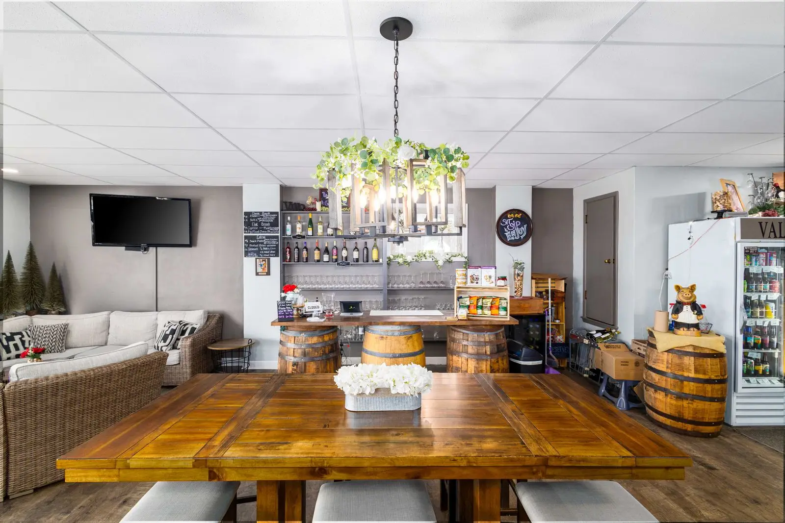 The oak barrel bar with wine glasses and bottles